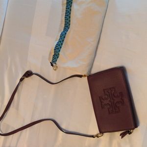 Tory Burch crossbody wallet purse in dark maroon color.